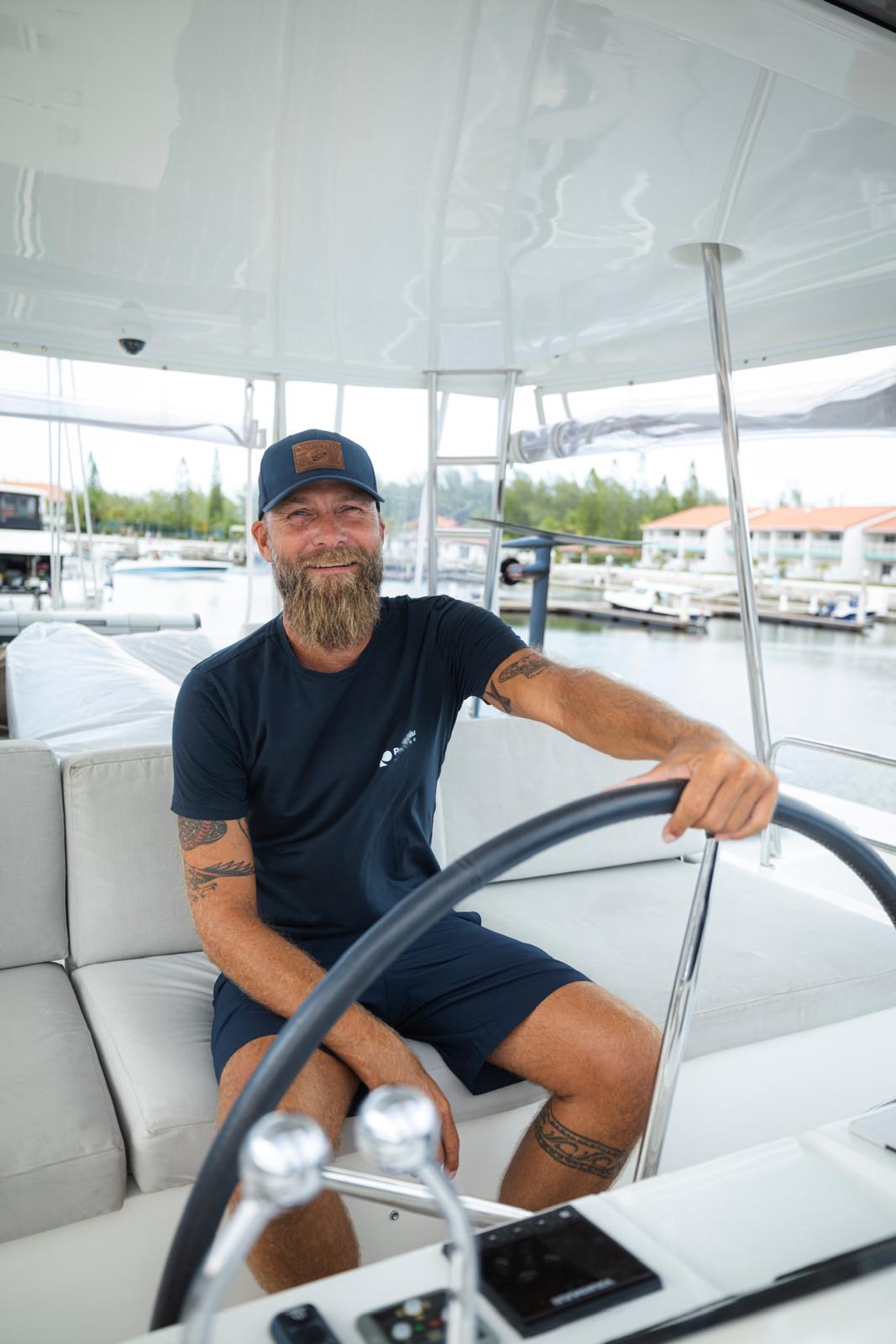 Captain John Livergood at the helm of PurelyBlu